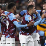 Image of Burnley Football Club players in a huddle.