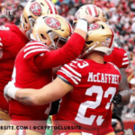 Image of players of San Francisco 49ers in a celebratory huddle