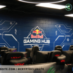Image of a blue wall with Red Bull logo painted on it.