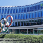 Image of facade of IOC Building. Monument signage of Olympic Logo at the front